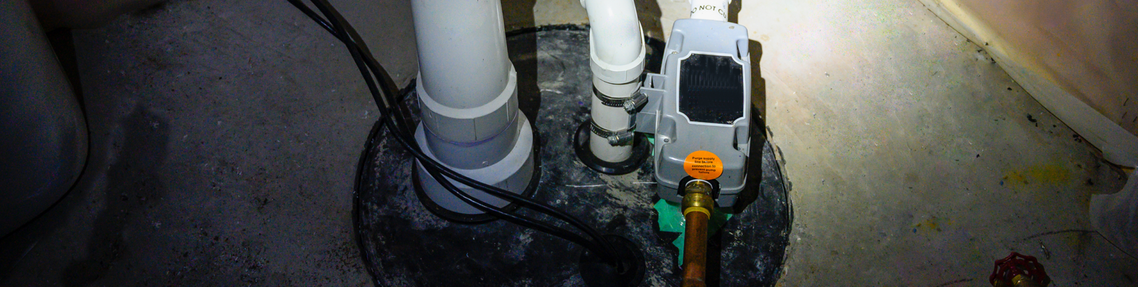 Radon gas monitoring equipment setup inside a home basement.